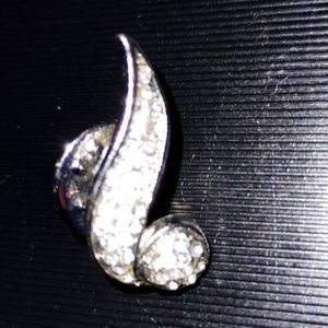 Abstract vintage silver rhinestone musical note